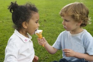 kid gives ice cream